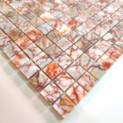 Shower or kitchen wall tile Rosso: marbled natural stone mosaic seen at an angle.