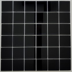 Modern kitchen backsplash: Installation of the mosaic in Black mirror glass using epoxy grout.