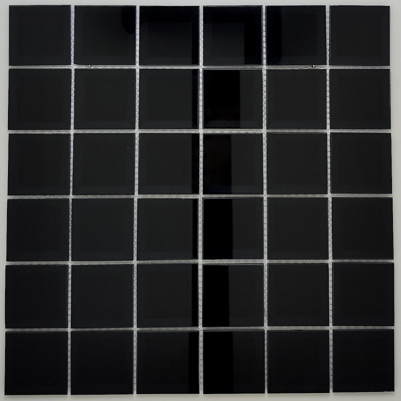 Modern kitchen backsplash: Installation of the mosaic in Black mirror glass using epoxy grout.